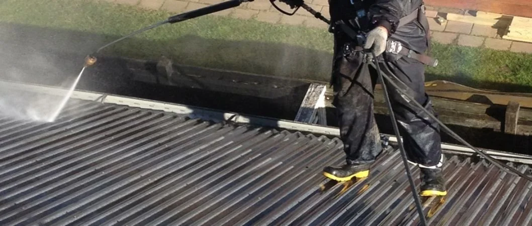 Water blasting cleaning an exterior surface